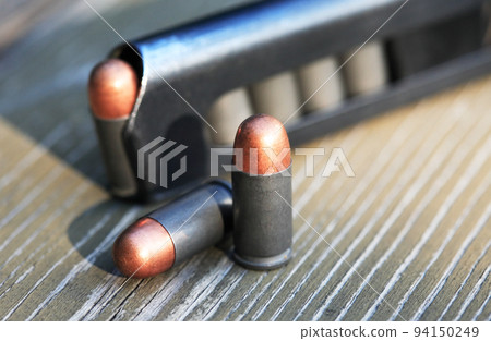 Pistol Cartridges On Wood Pistol Cartridges On Wood 94150249