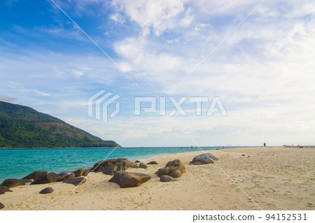 White sand beach tropical sea beach mountain view 94152531