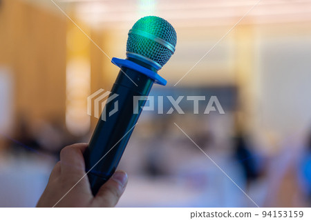 close up wireless mic in the seminar classroom with blur students behind 94153159