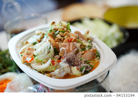 Cooking Thai traditional food called "Yam Woon Sen"; Glass Noodle,Pork,Nut Spicy Salad, Mung Bean Noodle Spicy Salad. 94153194
