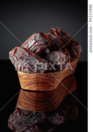 Dates on a black background. Dates on a black background. 94153996