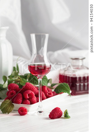 Raspberry liquor and fresh berries. Raspberry liquor and fresh berries. 94154030