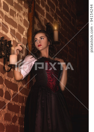 Fantastic medieval woman in the night castle Fantastic medieval woman in the night castle 94154244