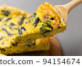 Bacon and spinach quiche on a cutting board 94154674
