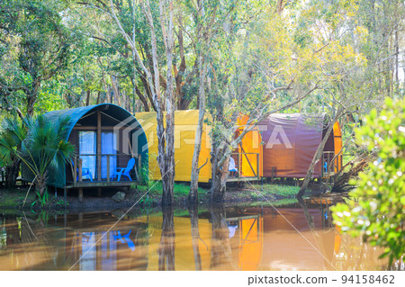 Colorful houses in tents by the water 94158462
