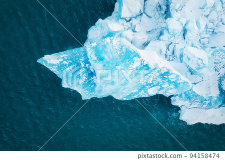 Iceland. An aerial view of an iceberg. Winter landscape from a drone. Jokulsarlon Iceberg Lagoon Iceland. An aerial view of an iceberg. Winter landscape from a drone. Jokulsarlon Iceberg Lagoon 94158474