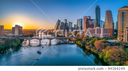Austin, Texas- Cityscape with Colorado River in the middle against the sunset sky Austin, Texas- Cityscape with Colorado River in the middle against the sunset sky 94164249