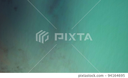 Top view of the turquoise-blue gradient of water Top view of the turquoise-blue gradient of water 94164695