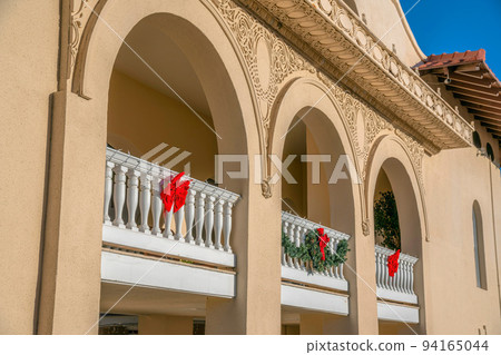 Downtown Tucson, Arizona- Building passageway exterior with arches and ornamental ribbons and wreath Downtown Tucson, Arizona- Building passageway exterior with arches and ornamental ribbons and wreath 94165044
