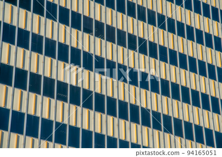 Modern building with yellow lines in between the window walls at downtown Tucson, Arizona 94165051