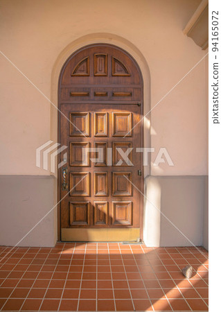 Arched wooden door of a church in downtown Tucson, Arizona Arched wooden door of a church in downtown Tucson, Arizona 94165072