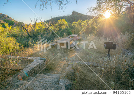 Sunset peeking through the campgrounds at Sabino Canyon State Park- Tucson, AZ Sunset peeking through the campgrounds at Sabino Canyon State Park- Tucson, AZ 94165105