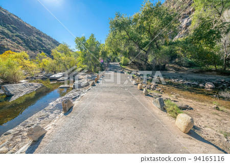 Concrete bridge pathway near the creek at Sabino Canyon State Park- Tucson, Arizona Concrete bridge pathway near the creek at Sabino Canyon State Park- Tucson, Arizona 94165116