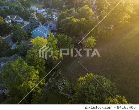 summer sunrise over residential area of Fort Collins in Colorado summer sunrise over residential area of Fort Collins in Colorado 94165406