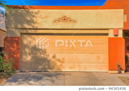 Large sectional garage door with concrete driveway in Tucson, Arizona Large sectional garage door with concrete driveway in Tucson, Arizona 94165436