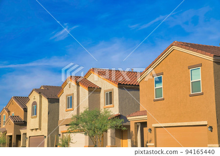 Suburban homes in Tucson, Arizona with attached garage 94165440