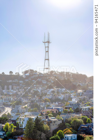 Misty view of residential area below Sutro Tower in San Francisco, California 94165471