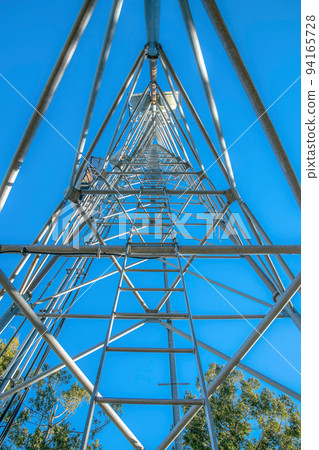 Mount Lemmon, Arizona- View of the center of the metal radio tower from below 94165728