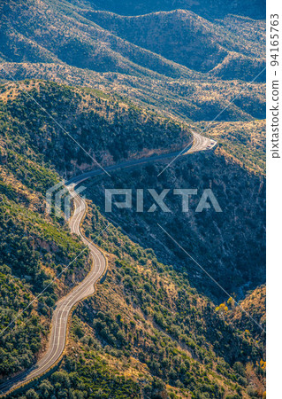 Mount Lemmon, Tucson, Arizona- High angle view of the mountainside winding road 94165763