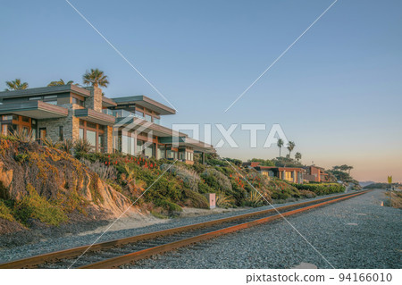 Houses at Del Mar Southern California along railroad on the beach at sunset Houses at Del Mar Southern California along railroad on the beach at sunset 94166010