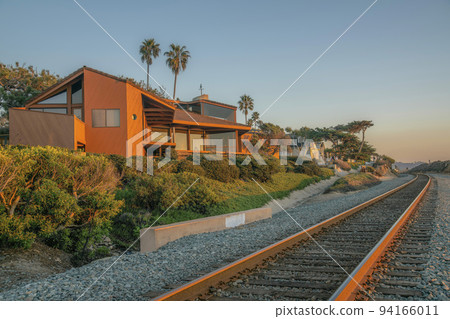 Houses along railroad and beach at Del Mar Southern California at sunset. Houses along railroad and beach at Del Mar Southern California at sunset. 94166011
