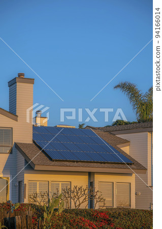 House with solar panels on roof at Del Mar Southern California against blue sky House with solar panels on roof at Del Mar Southern California against blue sky 94166014