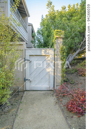 White wooden gate entry way to houses in Del Mar Southern California 94166039
