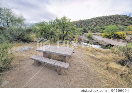 Sabino Canyon state park in Arizona with hiking trail and picnic table Sabino Canyon state park in Arizona with hiking trail and picnic table 94166094