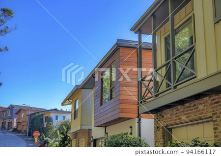 Beautiful homes along street road in a neighborhood in San Francisco California 94166117