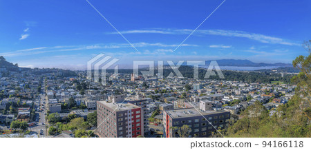 Panoramic aerial view of San Francisco downtown against blue sky on a sunny day 94166118