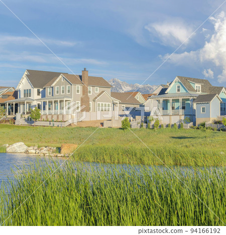Square White puffy clouds Panoramic view of blue waters of Oquirrh Lake at Daybreak in South Jordan, California 94166192