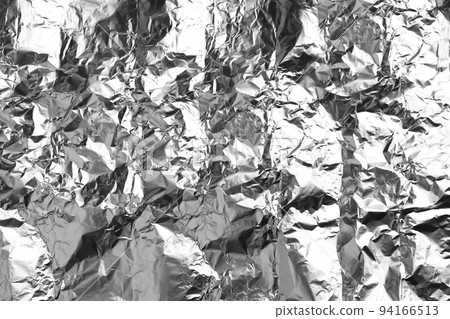 Crumpled silver foil as background, closeup view 94166513