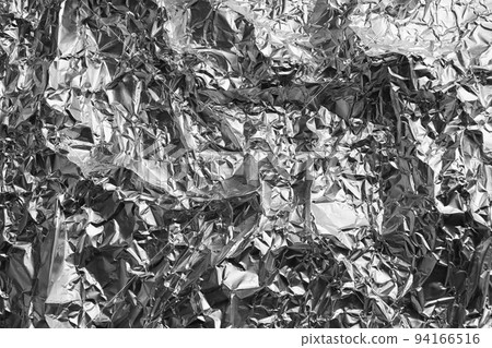 Crumpled silver foil as background, closeup view 94166516