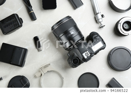 Flat lay composition with equipment for professional photographer on grey marble table 94166522