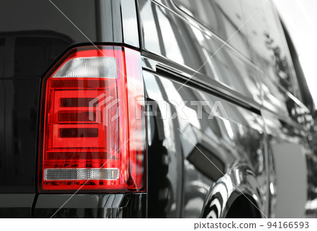 New luxury car in modern auto dealership, closeup New luxury car in modern auto dealership, closeup 94166593