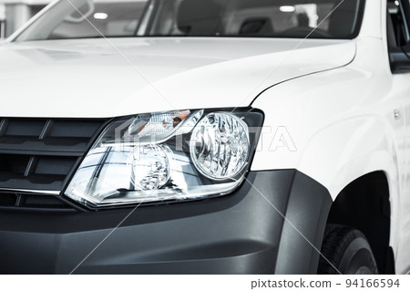 New luxury car in modern auto dealership, closeup New luxury car in modern auto dealership, closeup 94166594