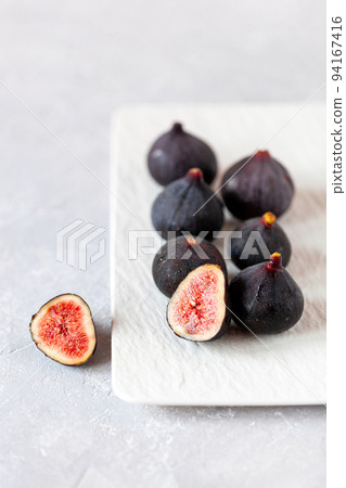Fresh ripe figs on a square plate 94167416