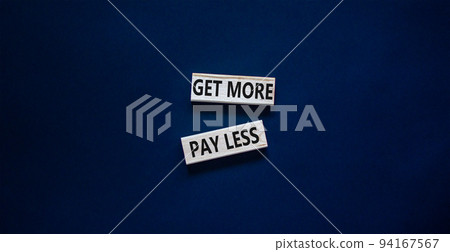 Get more pay less symbol. Concept words Get more pay less on wooden blocks on a beautiful black table black background. Business Get more pay less concept. Copy space. 94167567