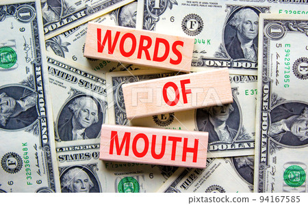 Words of mouth symbol. Concept words Words of mouth on wooden blocks on a beautiful background from dollar bills. Business, finacial and words of mouth concept. Copy space. Words of mouth symbol. Concept words Words of mouth on wooden blocks on a beautiful background from dollar bills. Business, finacial and words of mouth concept. Copy space. 94167585
