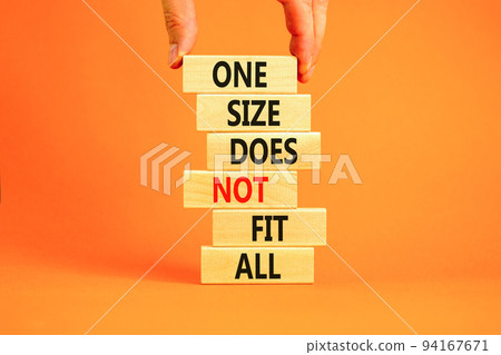 One size does not fit all symbol. Concept words One size does not fit all on wooden blocks. Businessman hand. Beautiful orange background. One size does not fit all business concept. Copy space. One size does not fit all symbol. Concept words One size does not fit all on wooden blocks. Businessman hand. Beautiful orange background. One size does not fit all business concept. Copy space. 94167671
