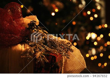 Close up photo on gorgeously wrapped Christmas presents on Christmas night Close up photo on gorgeously wrapped Christmas presents on Christmas night 94167832