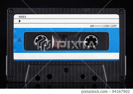 Blue labeled retro vintage compact cassette A - side on black Blue labeled retro vintage compact cassette A - side on black 94167902