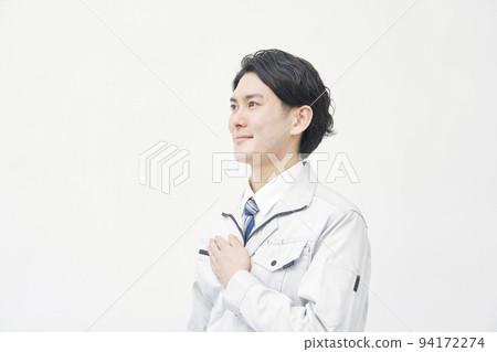 Portrait of a worker looking into the distance with a white background 94172274