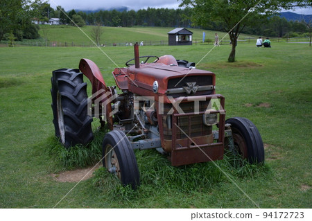 Landscape with a tractor at Nagato Ranch, Shirakaba Highland, Nagano Prefecture 94172723