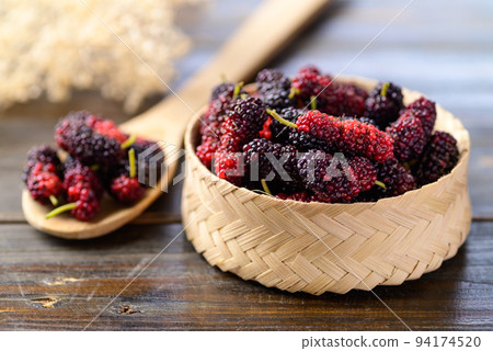 Fresh mulberry fruit in bamboo basket, Healthy tropical fruit Fresh mulberry fruit in bamboo basket, Healthy tropical fruit 94174520