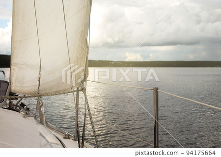 sail of a yacht sailing on the lake sail of a yacht sailing on the lake 94175664