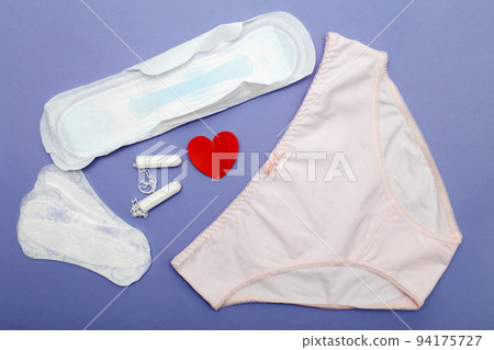 women's briefs with tampons, pads and panty liners . hygiene and women's health care concept 94175727