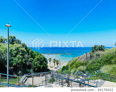 View of the sea and the skyline from the promenade in Netanya in Israel. View of the sea and the skyline from the promenade in Netanya in Israel. 94176832