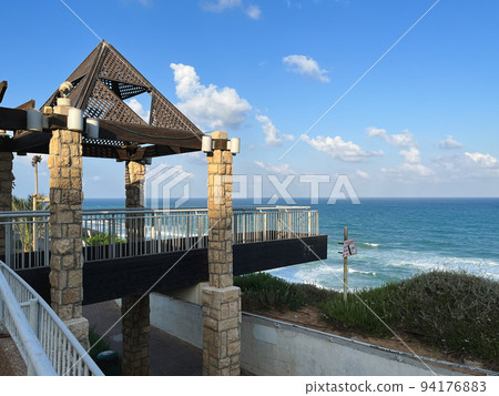 View of the sea and the skyline from the promenade in Netanya in Israel. View of the sea and the skyline from the promenade in Netanya in Israel. 94176883