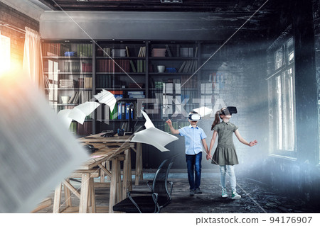 Kids wearing virtual reality goggles Kids wearing virtual reality goggles 94176907